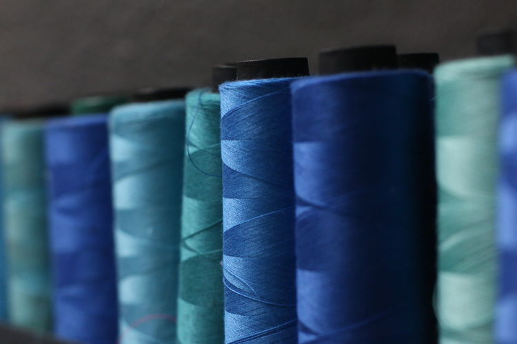 Blue thread. sewing thread.