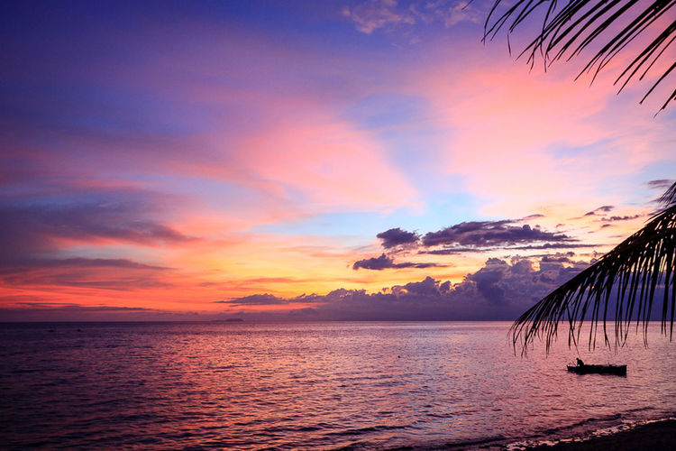 Scenic view of sea at sunset