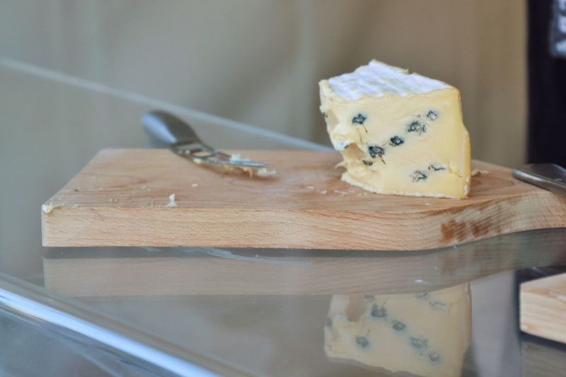 Close-up of cheese on chopping board