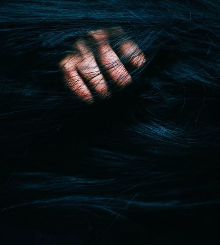 Close-up of hand in hair