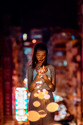 spirited away One Person One Woman Only Only Women Night One Young Woman Only Standing Portraits Light And Shadow Portrait Of A Woman Be. Ready. Beautiful People Photography Themes Fine Art Photography Light Light Up Your Life Fairy Lights Light Collection Bokeh Bokeh Photography Love Yourself The Portraitist - 2018 EyeEm Awards The Creative - 2018 EyeEm Awards