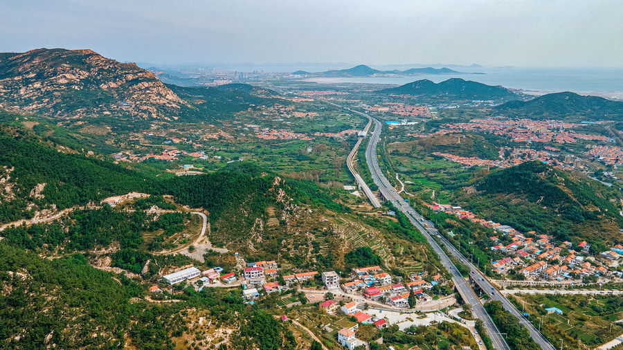 A mountain village on the suburban area crossed by a highway
