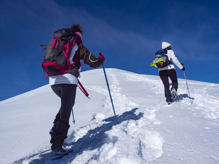 Winter trekking scene in the italian alps