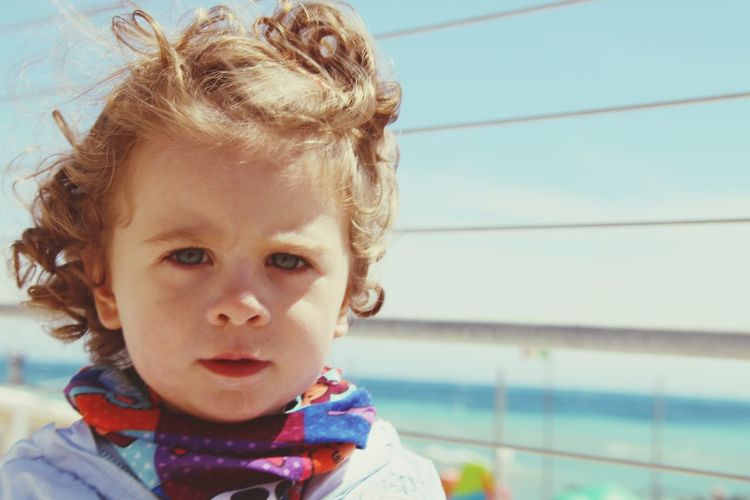 Portrait of cute girl looking at swimming pool