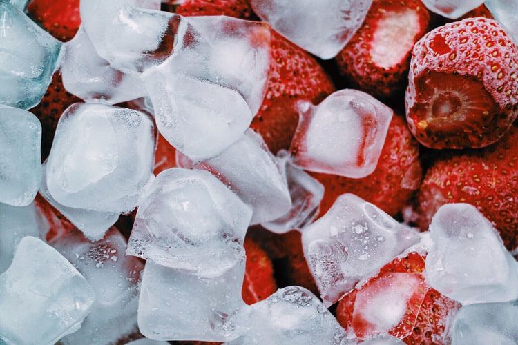 Close-up of strawberries and ice cubes