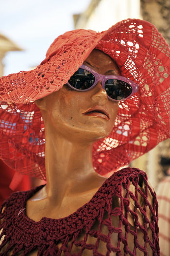 Close-up of mannequin with sunglasses and hat