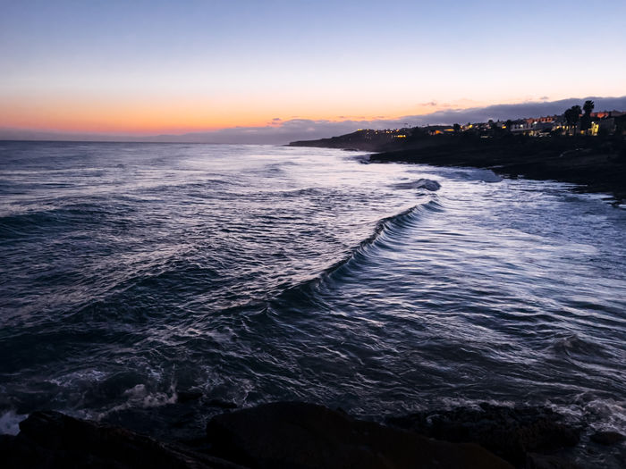 Scenic view of sea against sky during sunset