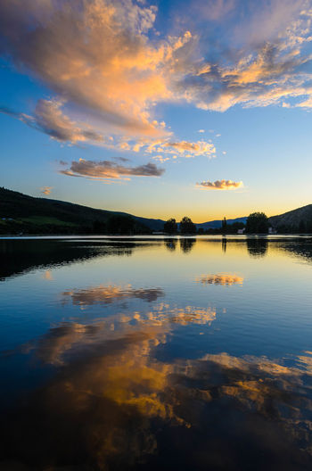 Clouds reflecting off of nottingham lake at sunset in avon, colorado, usa