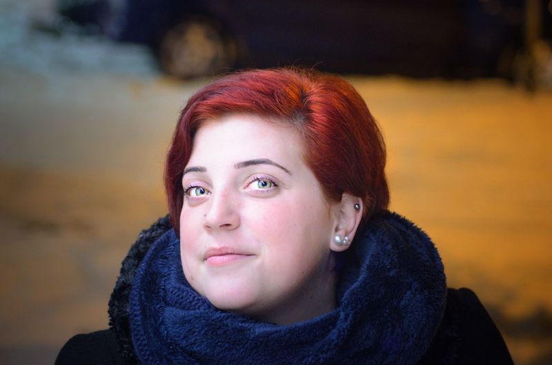 Close-up portrait of a young woman in winter