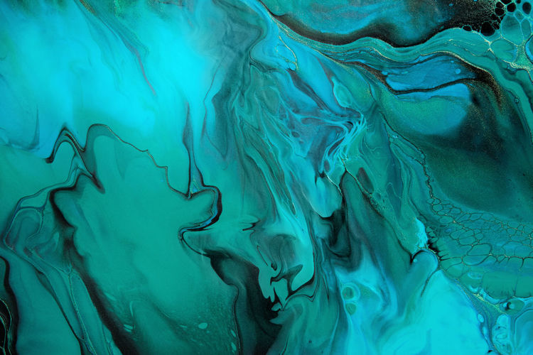 Fluid art. green and blue abstract wave swirls on black background. marble effect background or