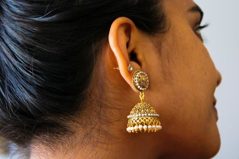 Close-up of woman wearing earring