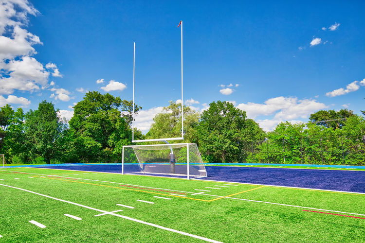 Scenic view of soccer field against sky