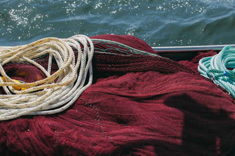 High angle view of fishing net on boat