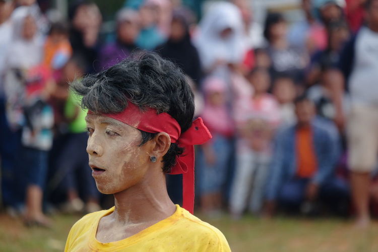 Man wearing headband during traditional festival