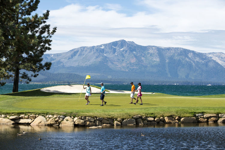 A group of friends golfing at edgewood tahoe in stateline, nevada.