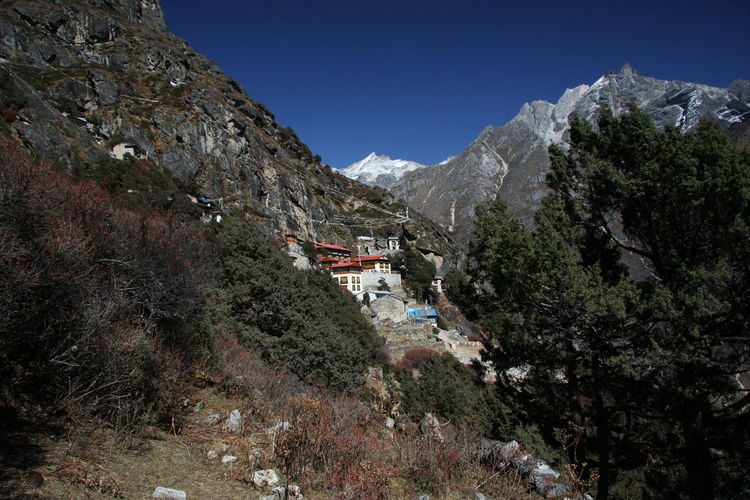 Scenic view of himalaya mountains against sky with bhuddism monastery at khumbu, nepal