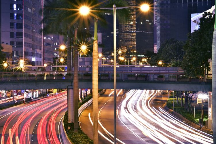 High angle view of light trails on road at night