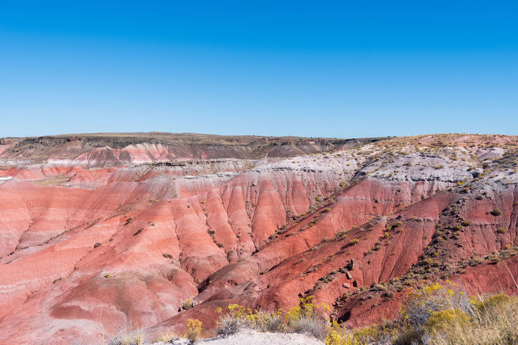 Pink and white hilly valley at the painted hills in petrified forest national park in arizona