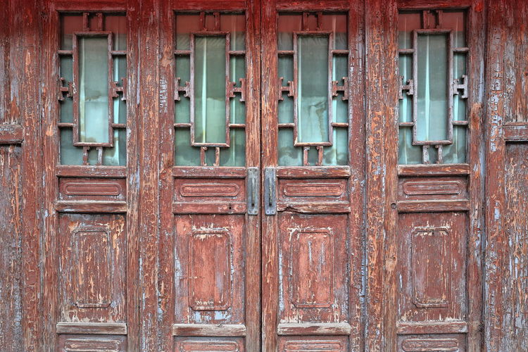 1562 chinese door-wooden panels-chipped-cracked-weathered. shuyuanmen calligraphy street-xi'an-china