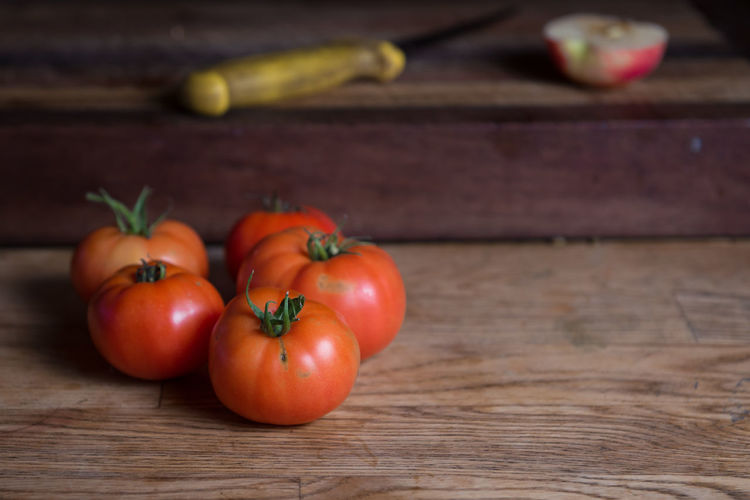 Close-up of tomatoes on wooden table