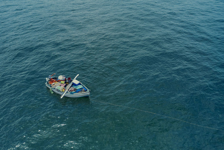 Aerial view, fishing boat with artisanal fishermen near the shore