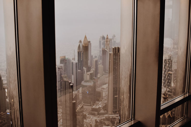 Buildings seen through glass window