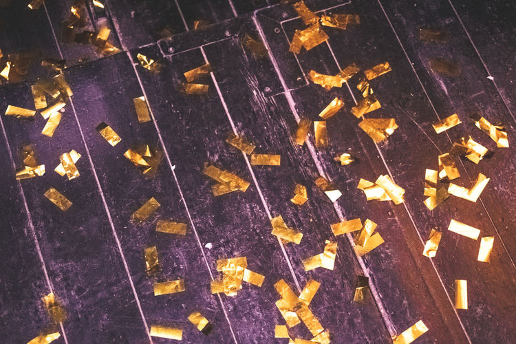 High angle view of confetti on wooden floor