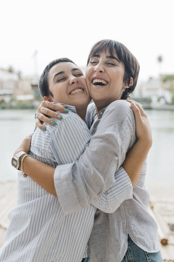Cheerful lesbian couple embracing each other