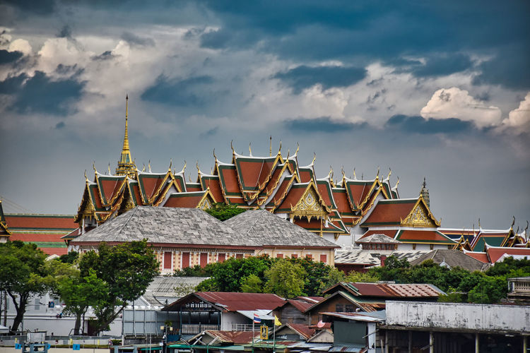 Landscape view of the beautiful traditional thai roofs of the grand palace from wat arun
