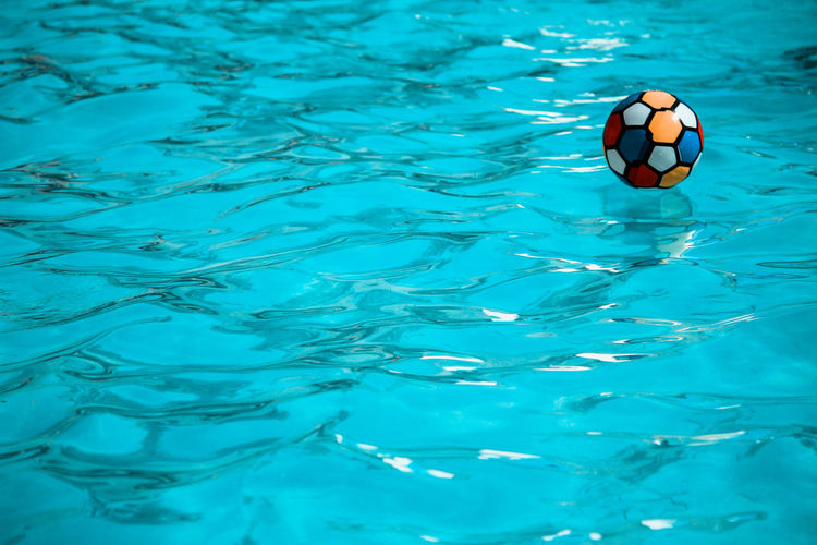 Close-up of blue ball in swimming pool