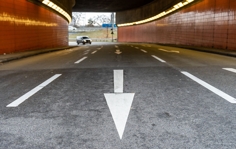 Arrow symbol on road in tunnel