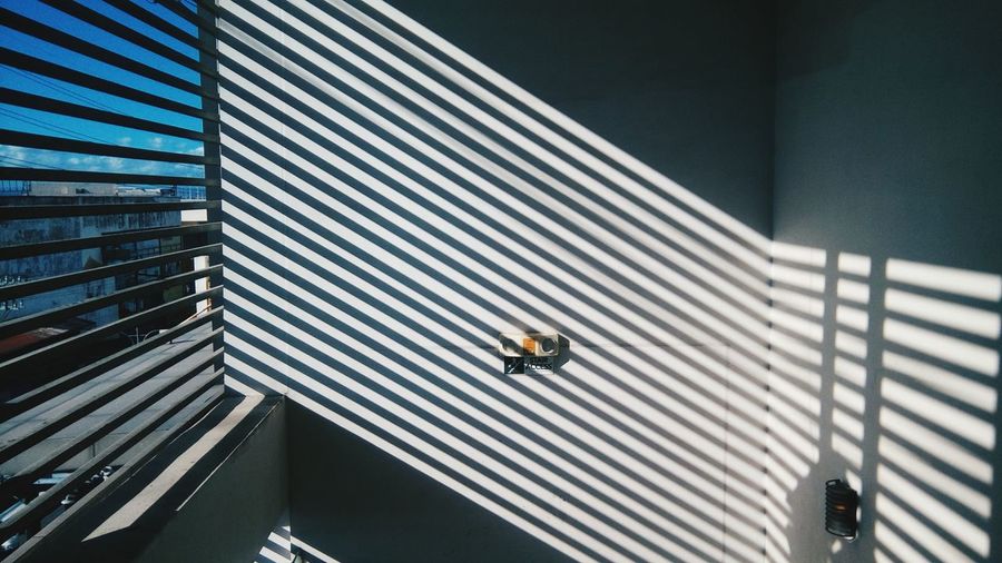 Shadow of blinds on wall