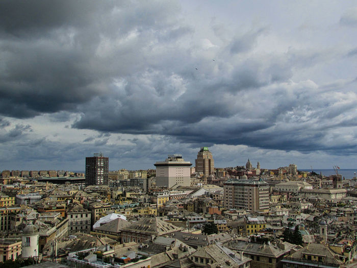 High angle view of cityscape against storm clouds