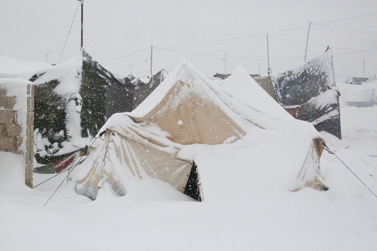The tragic conditions of refugee camps near the turkish-syrian border.