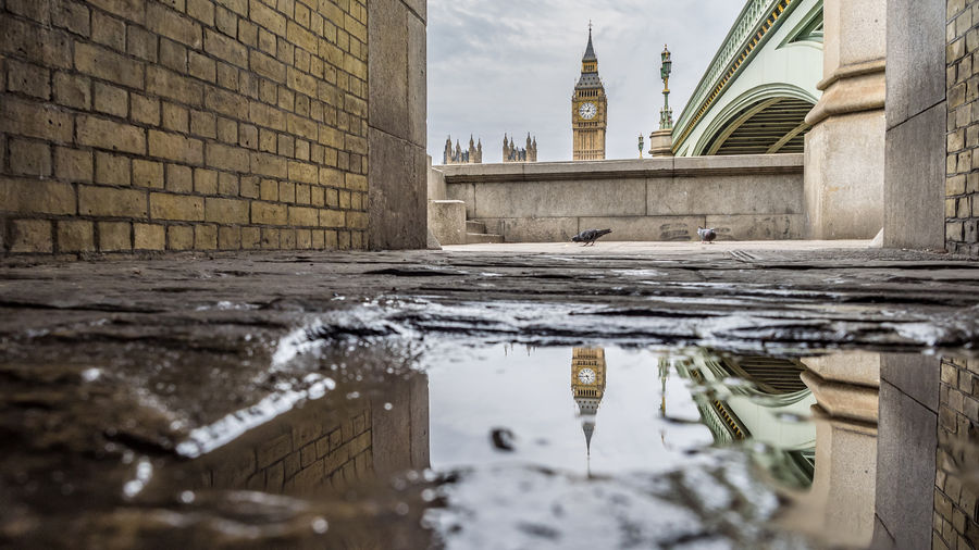 Reflection of big ben in puddle