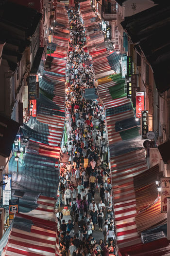 High angle view of crowd in city market at night