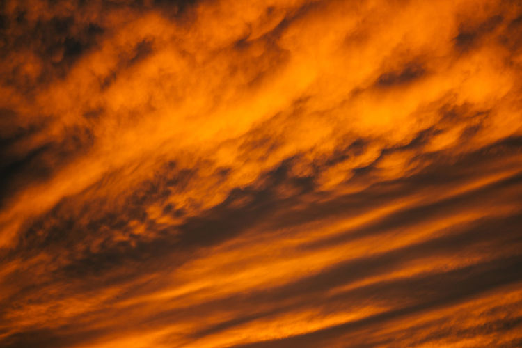 Low angle view of dramatic sky during sunset