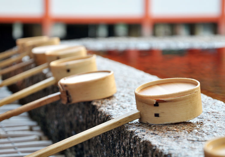 Dipping cups at itsukushima shrine or miyajima island