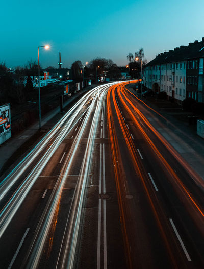 High angle view of light trails on highways at night