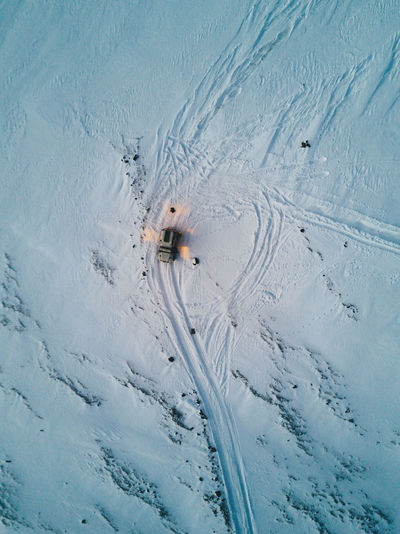 High angle view of car on snow covered landscape
