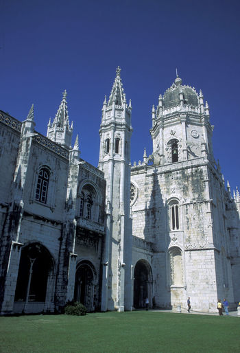 Low angle view of mosteiro dos jeronimos against clear sky