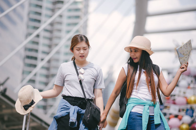 Tourists standing in city