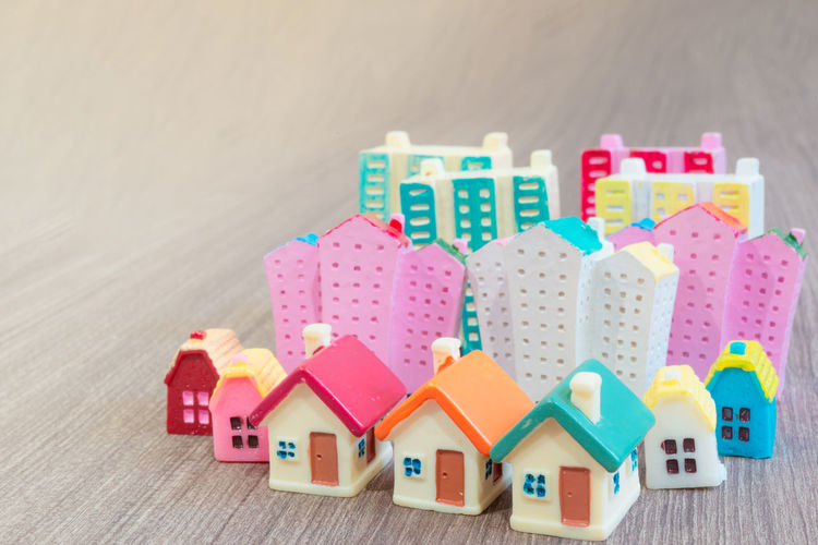 Close-up of toys on table against building