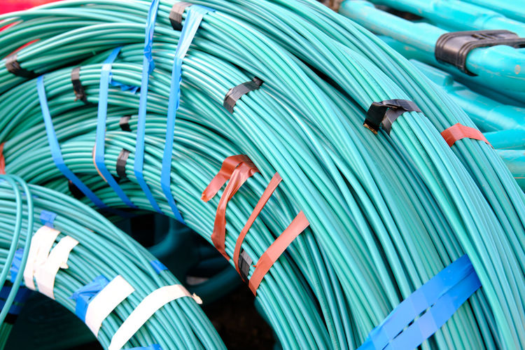Rolls of light blue underground fibre optic cable.
