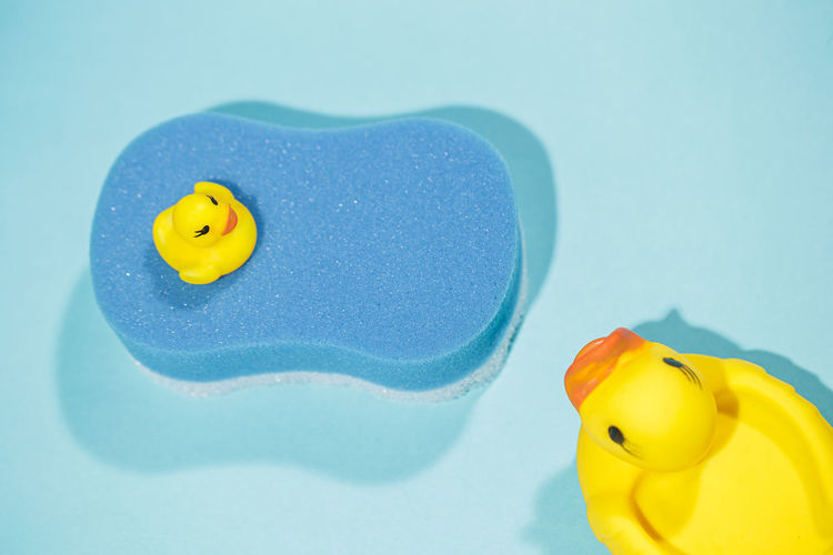 Close-up of yellow toys floating on water