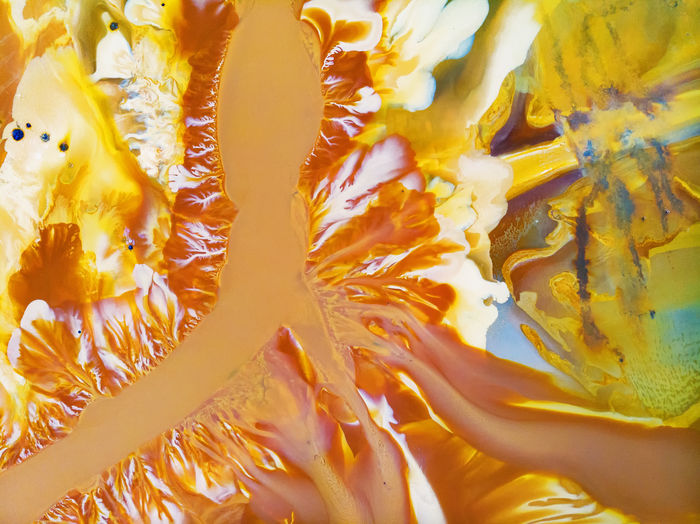 Full frame shot of water drops on orange wall