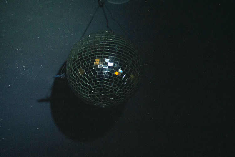 Illuminated lighting equipment hanging at night