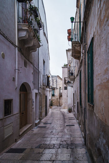 Narrow alley amidst buildings in town