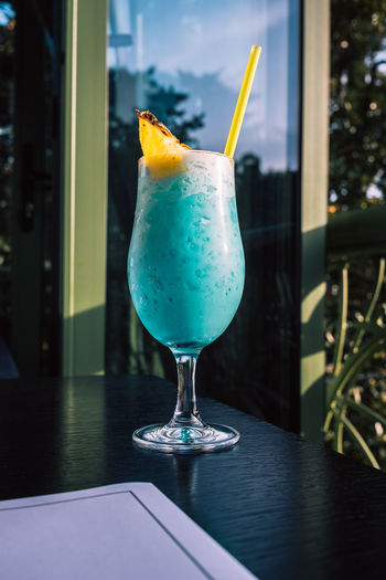 Tropical cocktails with pineapple and straw in glasses. pina colada. blue curacao. 