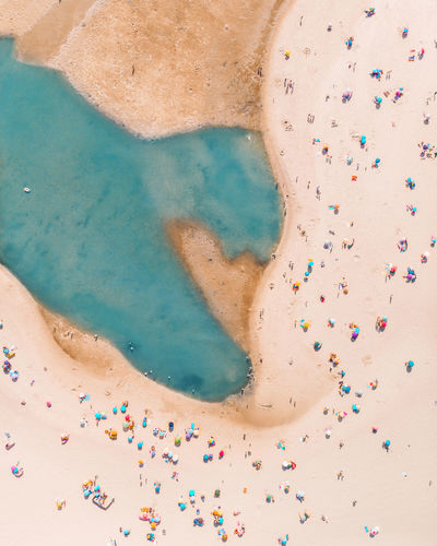 Aerial view of people enjoying at beach